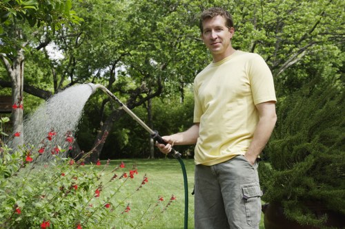 Landscape workers applying safety checks during garden maintenance